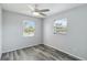 Bedroom with a ceiling fan and two windows at 111 66Th Street E Ct, Bradenton, FL 34208