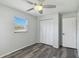 Cozy bedroom with a ceiling fan, closet, and window at 111 66Th Street E Ct, Bradenton, FL 34208