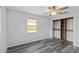Bedroom with a ceiling fan, closet, and window at 111 66Th Street E Ct, Bradenton, FL 34208