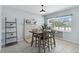 Charming dining area with a window seat, modern light fixture, and decorative brick feature for cozy meals at 111 66Th Street E Ct, Bradenton, FL 34208
