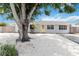 Charming single-story home with a well-maintained yard, a yellow front door, and a welcoming curb appeal at 111 66Th Street E Ct, Bradenton, FL 34208