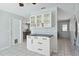Kitchen with white cabinets, black countertops, and modern fixtures at 111 66Th Street E Ct, Bradenton, FL 34208