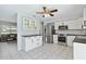 Bright kitchen featuring stainless steel appliances, white cabinets, and modern fixtures at 111 66Th Street E Ct, Bradenton, FL 34208