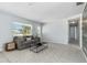 Open-concept living room with tile floors, stylish furniture, and a bright, airy atmosphere at 111 66Th Street E Ct, Bradenton, FL 34208