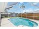 Screened-in pool area with a sparkling blue pool, perfect for relaxation and outdoor enjoyment at 111 66Th Street E Ct, Bradenton, FL 34208