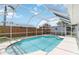 Refreshing screened-in pool with clear blue water and a relaxing atmosphere, steps lead into the pool at 111 66Th Street E Ct, Bradenton, FL 34208