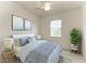 Comfortable bedroom featuring neutral walls, natural light, and stylish decor at 11327 Burgundy Dr, Venice, FL 34293