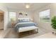 A light-filled bedroom features neutral decor at 11327 Burgundy Dr, Venice, FL 34293