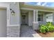 An inviting entryway with stone pillars and manicured landscaping at 11327 Burgundy Dr, Venice, FL 34293