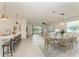 The open-concept living space includes a dining area and access to outdoor views at 11327 Burgundy Dr, Venice, FL 34293