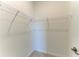 A walk-in closet with wire shelving and neutral walls at 11327 Burgundy Dr, Venice, FL 34293