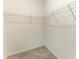 A walk-in closet has wire shelving and ample storage space at 11327 Burgundy Dr, Venice, FL 34293