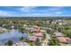 Beautiful aerial view of home with landscaping and a screened pool near a pond at 11328 Rivers Bluff Cir, Lakewood Ranch, FL 34202