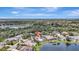 Aerial view of beautiful home with landscaping and pool near a pond at 11328 Rivers Bluff Cir, Lakewood Ranch, FL 34202