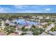 Enjoy an aerial view of this lakeside home with a pool, nestled among trees and other beautiful residences at 11328 Rivers Bluff Cir, Lakewood Ranch, FL 34202