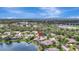 Beautiful aerial view of home with landscaping and a screened pool near a pond at 11328 Rivers Bluff Cir, Lakewood Ranch, FL 34202