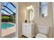 Bathroom with view to outside pool area at 11328 Rivers Bluff Cir, Lakewood Ranch, FL 34202
