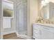 Bathroom featuring a glass shower, updated sink and vanity, and bright window for added charm at 11328 Rivers Bluff Cir, Lakewood Ranch, FL 34202