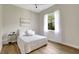 Bright bedroom with a leafy view outside the window, white walls, and a ceiling fan at 11328 Rivers Bluff Cir, Lakewood Ranch, FL 34202