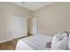 Bedroom featuring a large closet with sliding doors, white walls, and a ceiling fan at 11328 Rivers Bluff Cir, Lakewood Ranch, FL 34202