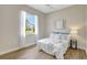 Light bedroom with large window and neutral decor at 11328 Rivers Bluff Cir, Lakewood Ranch, FL 34202