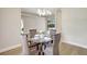 Bright dining area featuring a glass table and view to living space at 11328 Rivers Bluff Cir, Lakewood Ranch, FL 34202