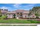 Charming single-story home with a meticulously landscaped front yard, enhancing curb appeal and inviting ambiance at 11328 Rivers Bluff Cir, Lakewood Ranch, FL 34202