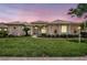 Charming single-story home with a well-manicured lawn and lush landscaping at 11328 Rivers Bluff Cir, Lakewood Ranch, FL 34202