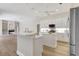 Spacious white kitchen features a large island, modern appliances, and stylish lighting at 11328 Rivers Bluff Cir, Lakewood Ranch, FL 34202