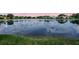 Beautiful lake view homes with green grass at waters edge at 11328 Rivers Bluff Cir, Lakewood Ranch, FL 34202