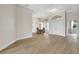 Large living area with wood floors, double doors, and an adjacent dining area at 11328 Rivers Bluff Cir, Lakewood Ranch, FL 34202