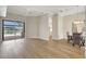 Spacious living area featuring wood floors and access to the dining room at 11328 Rivers Bluff Cir, Lakewood Ranch, FL 34202
