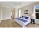 Bright main bedroom with hardwood floors and an open hallway at 11328 Rivers Bluff Cir, Lakewood Ranch, FL 34202