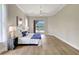 Bright main bedroom showcasing a sliding glass door with pool views and light wood flooring at 11328 Rivers Bluff Cir, Lakewood Ranch, FL 34202