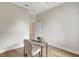 Home office features a simple modern desk with chair, and light wood floors at 11328 Rivers Bluff Cir, Lakewood Ranch, FL 34202