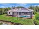 A beautiful pool and outdoor patio with dark metal enclosure at 11328 Rivers Bluff Cir, Lakewood Ranch, FL 34202