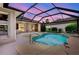 Backyard pool area with nice landscaping and lake view at 11328 Rivers Bluff Cir, Lakewood Ranch, FL 34202