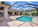 Backyard pool area with nice landscaping and lake view at 11328 Rivers Bluff Cir, Lakewood Ranch, FL 34202