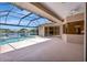 Backyard pool area with lake view at 11328 Rivers Bluff Cir, Lakewood Ranch, FL 34202