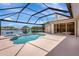 A screened-in pool offers a refreshing escape with beautiful lake views, blending relaxation and scenic beauty at 11328 Rivers Bluff Cir, Lakewood Ranch, FL 34202