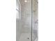 Modern glass shower with marble style tile and built in niche at 11328 Rivers Bluff Cir, Lakewood Ranch, FL 34202