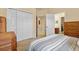 Comfortable bedroom featuring neutral walls, a large closet, and an attached bathroom at 11508 30Th E Cv, Parrish, FL 34219