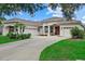 Stunning single Gathering home with a well manicured lawn, three car garage and beautiful curb appeal at 11508 30Th E Cv, Parrish, FL 34219