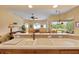 Kitchen sink view of large kitchen counter and living room/dining room area and large windows at 11508 30Th E Cv, Parrish, FL 34219