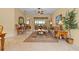 Cozy living room featuring neutral walls, tile floors, and an open floor plan leading to the screened patio at 11508 30Th E Cv, Parrish, FL 34219