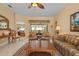 Cozy living room featuring neutral walls and views of the backyard at 11508 30Th E Cv, Parrish, FL 34219