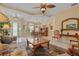 Open living room with large windows and a neutral color scheme at 11508 30Th E Cv, Parrish, FL 34219