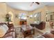 Comfortable living room with large windows and views of the lanai, pool, and backyard at 11508 30Th E Cv, Parrish, FL 34219