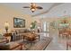 Bright and airy living room with tile floors and neutral tones at 11508 30Th E Cv, Parrish, FL 34219
