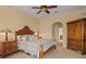 Bedroom showcasing a ceiling fan, dresser, nightstand, and plush carpeting at 11508 30Th E Cv, Parrish, FL 34219